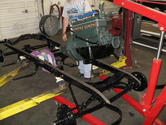 Installing the engine into the chassis.